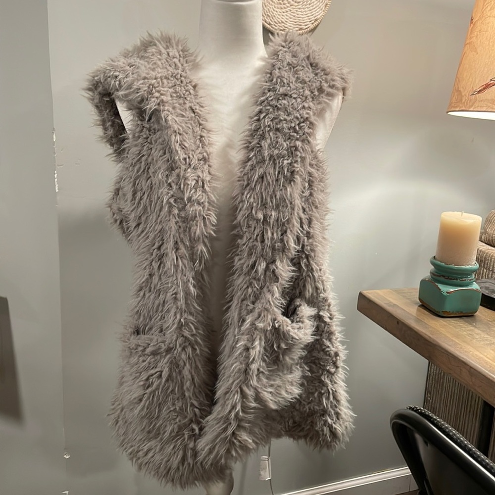 Like new furry hooded vest ! So fun !